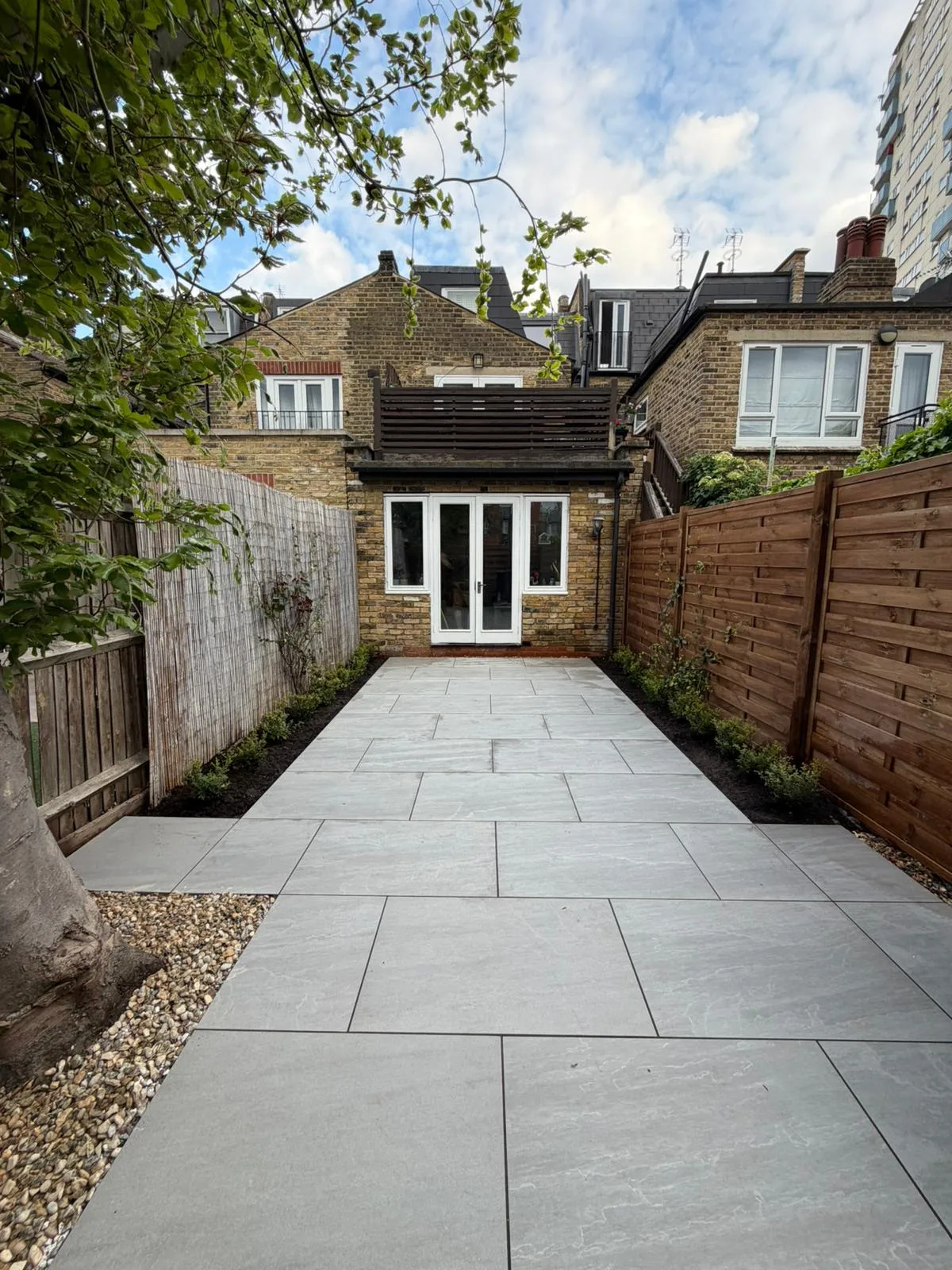 Completed porcelain patio viewed from rear of property Battersea
