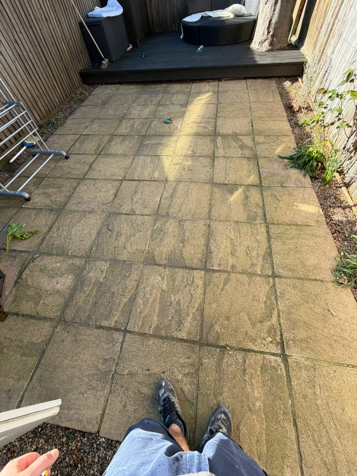 Old paving close up showing cracks and discolouration before transformation Battersea