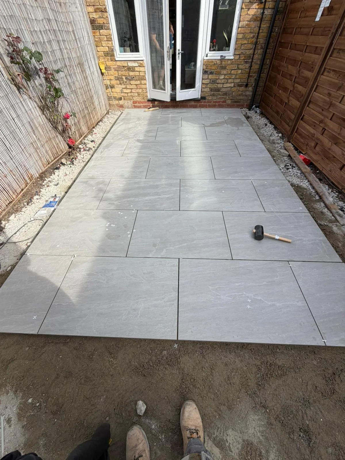 Porcelain patio being laid in Battersea garden SW11