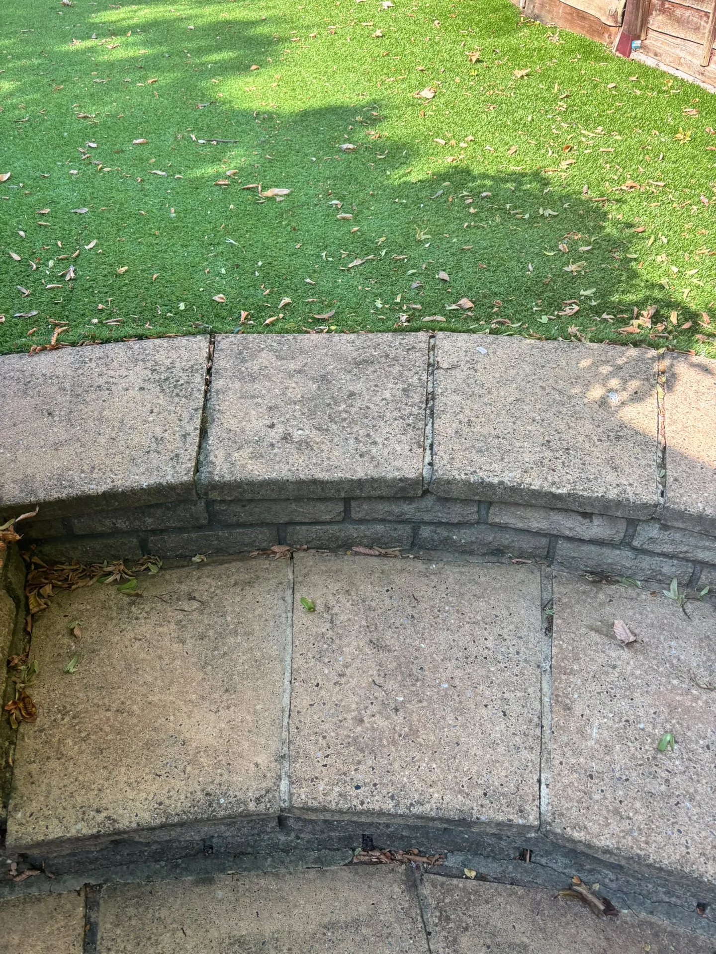Restored stone patio bench after Karcher K4 pressure washing in Woodford, IG8 9JN