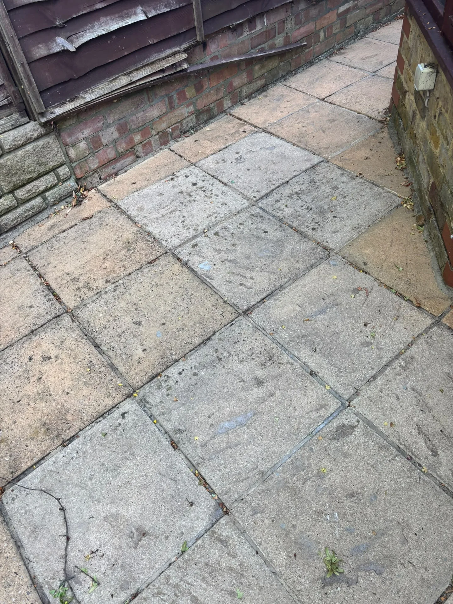 Pressure washed side passage slabs restored to an even, light stone colour in Woodford, IG8 9JN