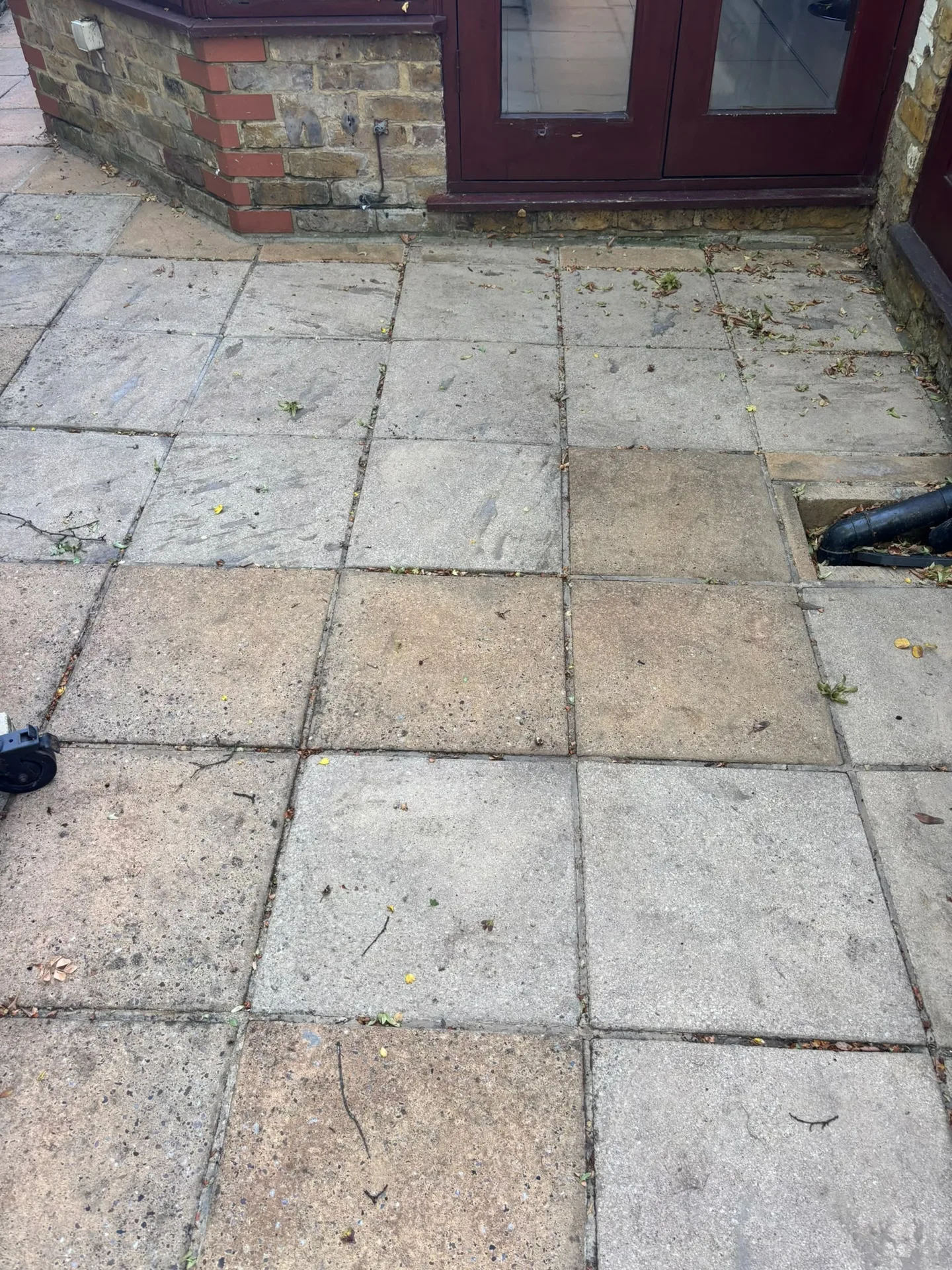 Patio slabs outside French doors cleaned with a Karcher K4 pressure washer in Woodford, IG8 9JN