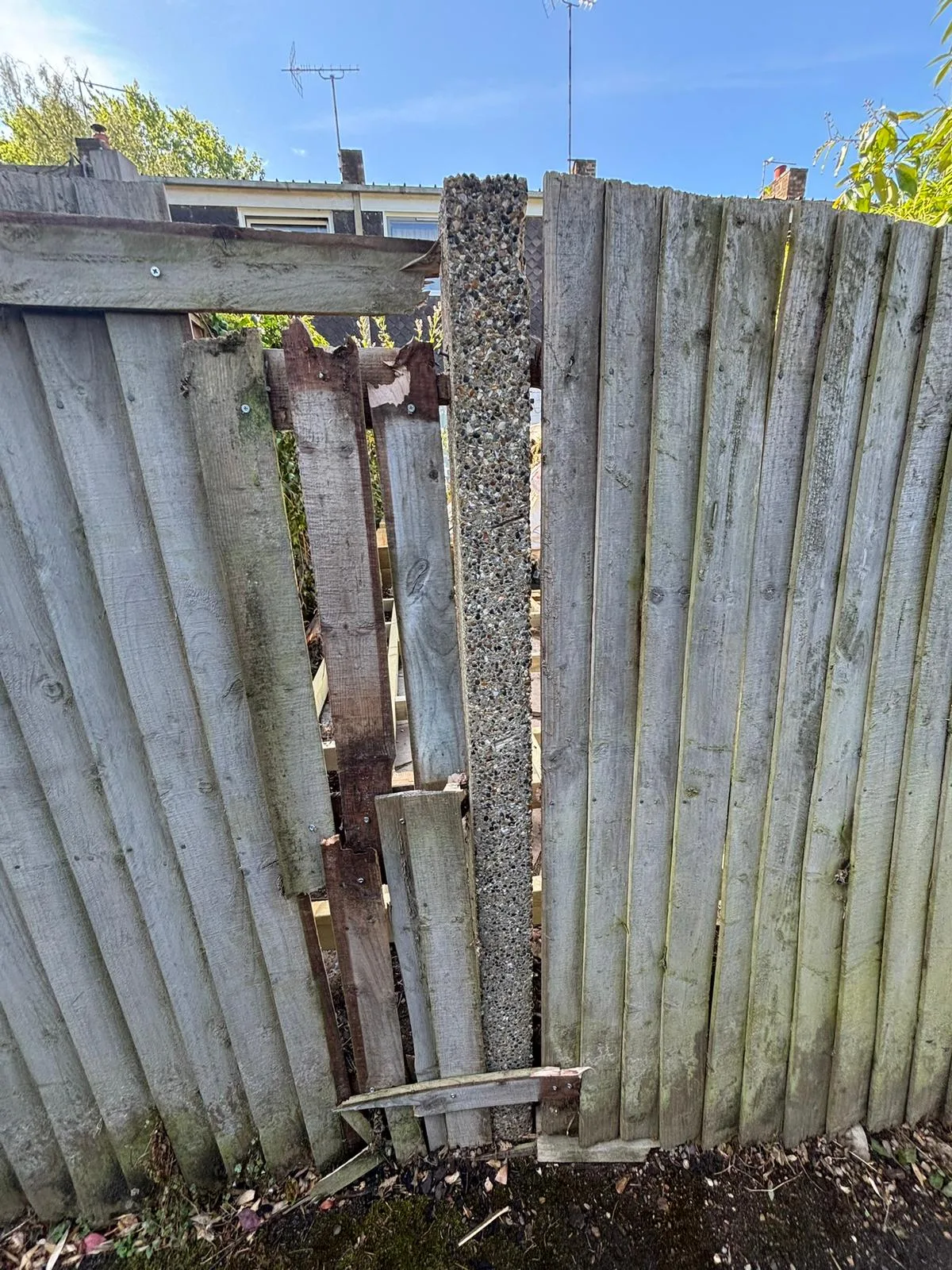 Snapped concrete fence post