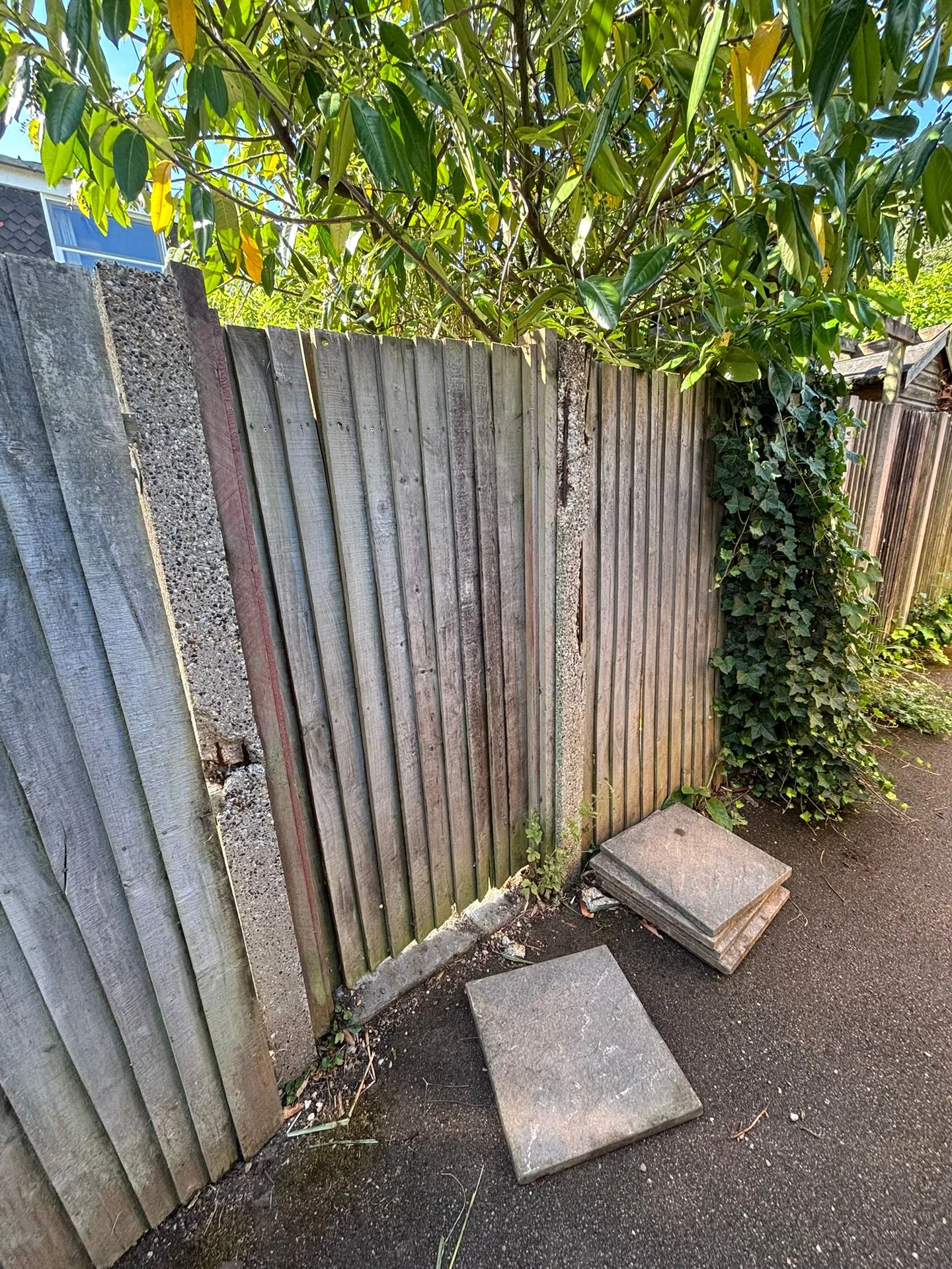 Leaning fence before repair