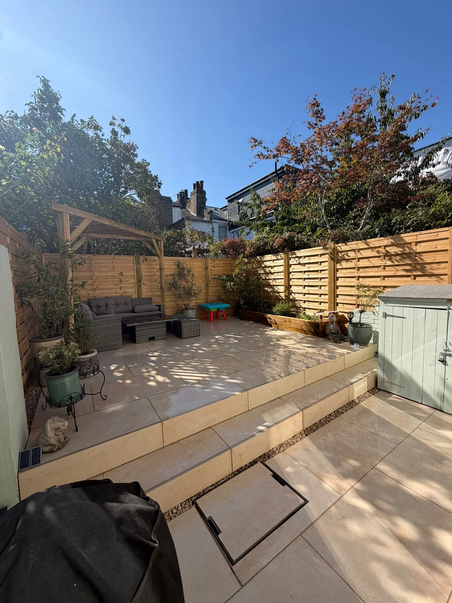 Complete garden landscaping project in Greenwich, patio, pergola and fencing