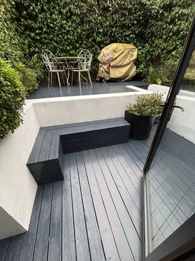 Grey composite decking in a modern London courtyard